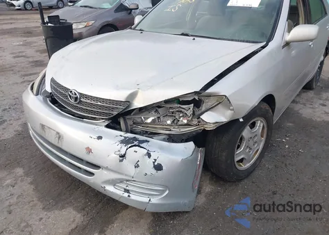 2003 Toyota Camry Le z USA, uszkodzony, nr VIN 4T1BF32K23U043478